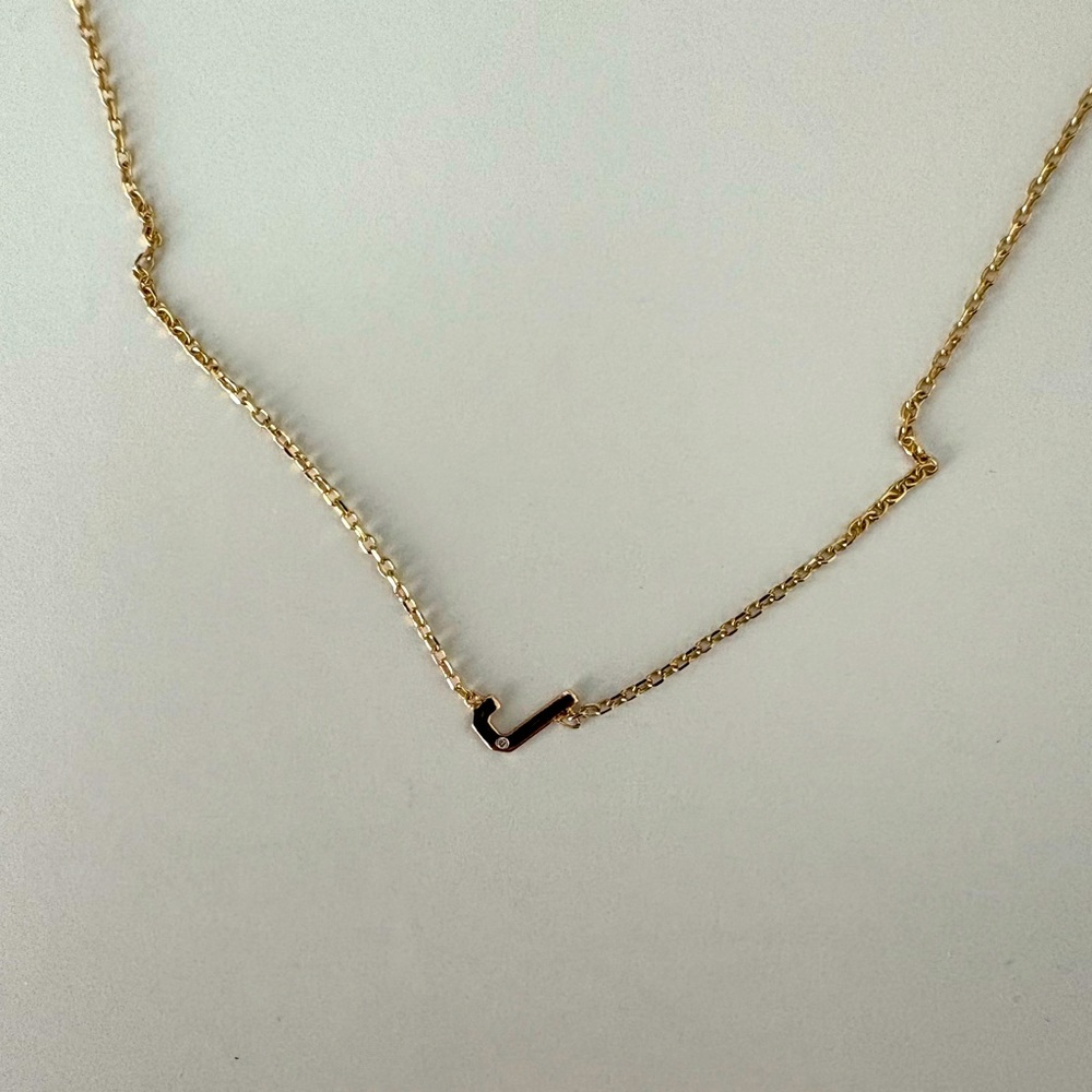 Mini “J” initial with single diamond necklace